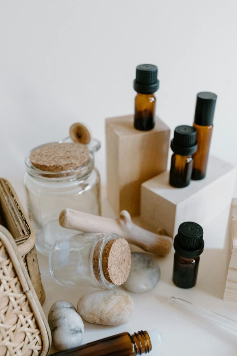 A curated still life showcasing essential oils and natural elements for aromatherapy.